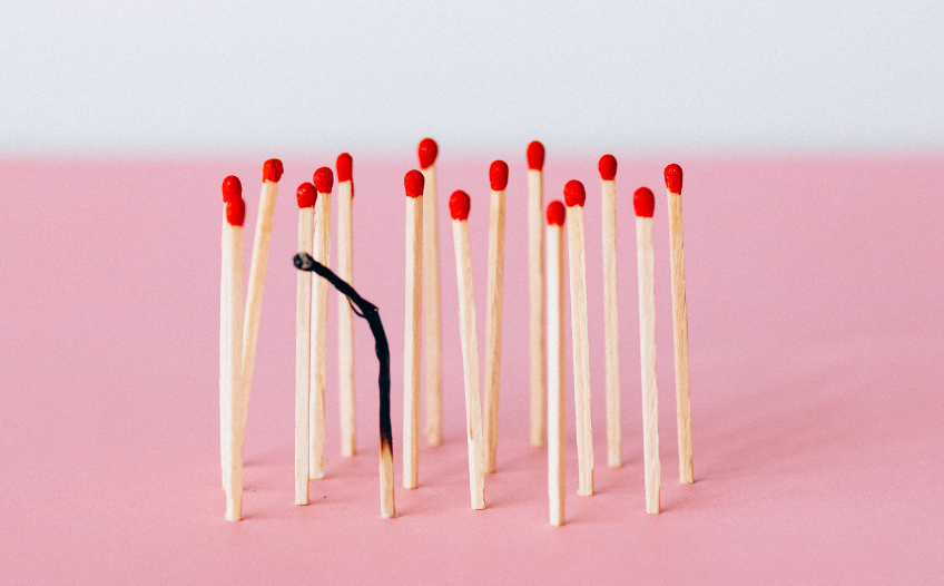 Matches standing up with one burnt out